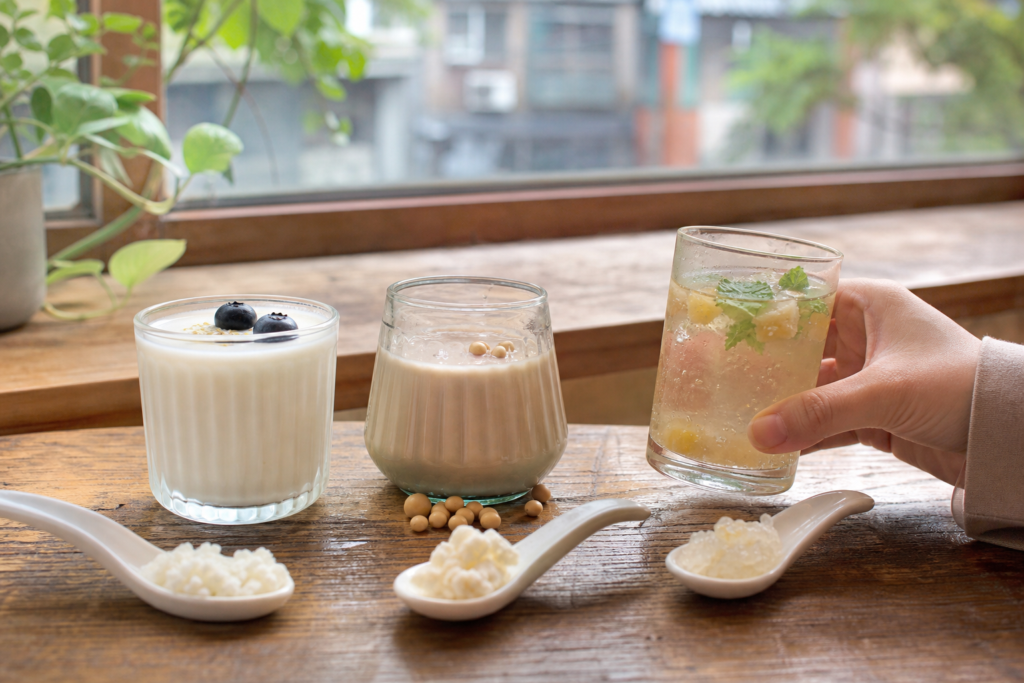 Distinct kefir drinks shown with natural texture and ingredient cues on a kitchen counter.